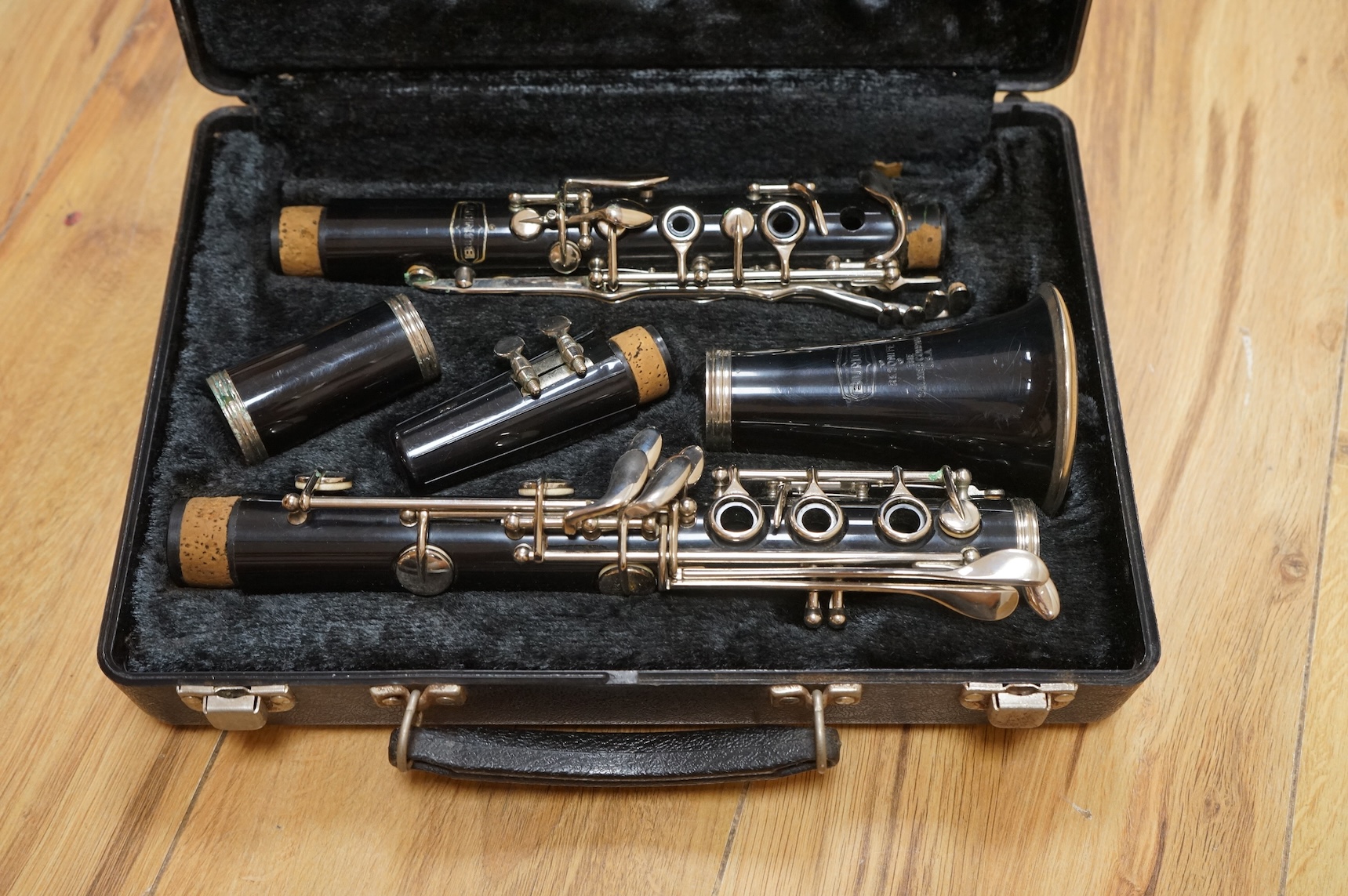 A cased Selmer plastic Bb clarinet.